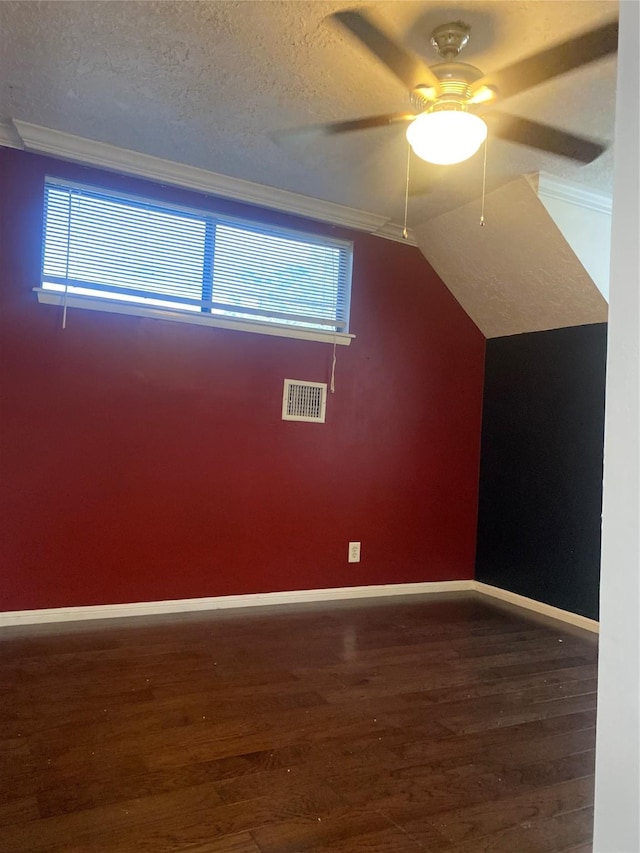 bonus room featuring dark hardwood / wood-style floors, a wealth of natural light, and lofted ceiling