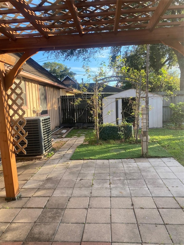 view of patio with a pergola, central air condition unit, and a storage shed