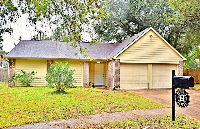 single story home featuring a front yard and a garage