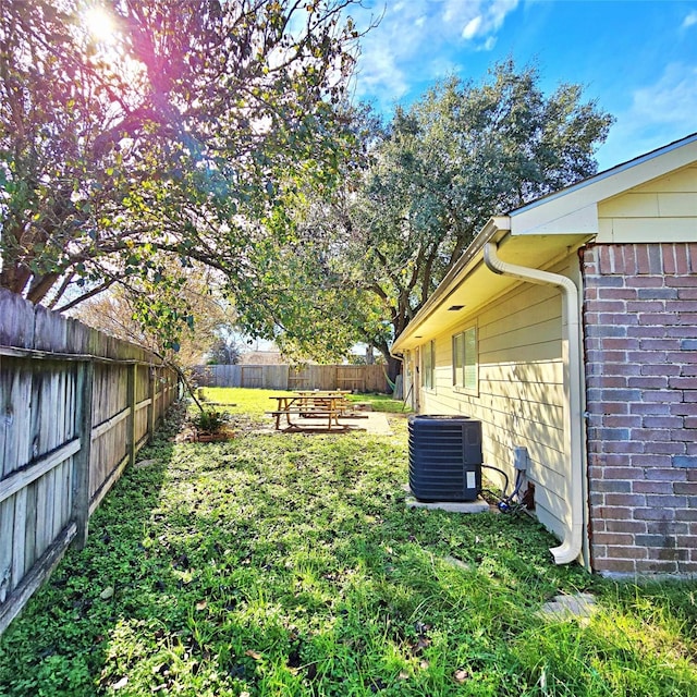 view of yard with central air condition unit