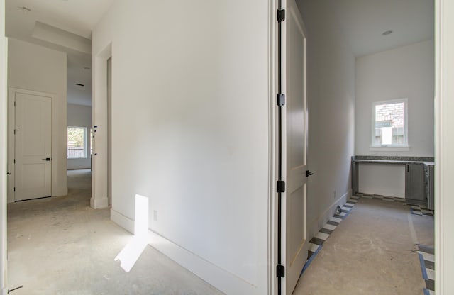 hallway featuring plenty of natural light