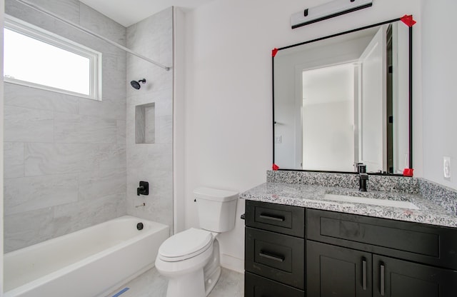 full bathroom with vanity, toilet, and tiled shower / bath