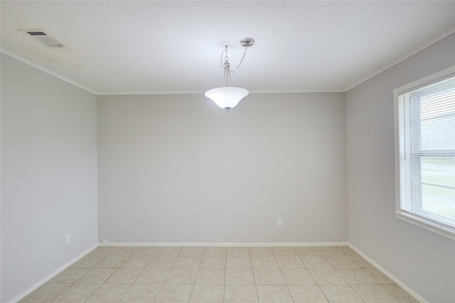 tiled spare room with ornamental molding