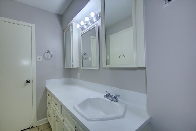 bathroom featuring tile patterned floors and vanity