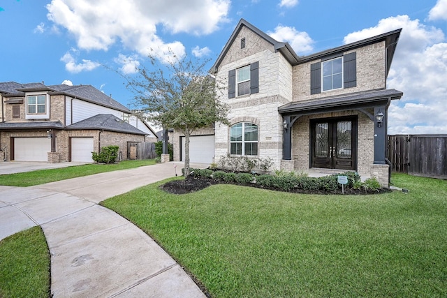 view of front facade featuring french doors, a garage, and a front lawn