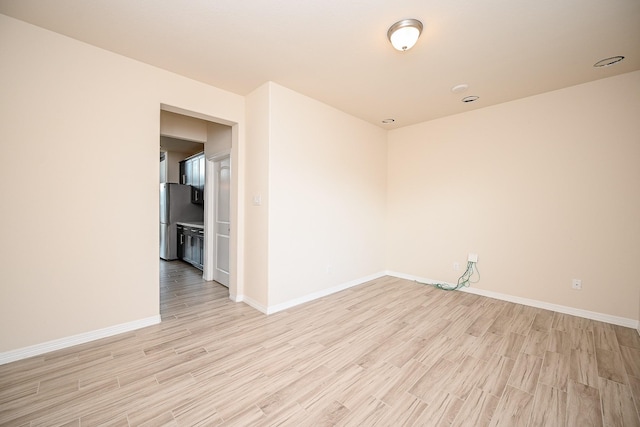 unfurnished room featuring light wood-type flooring