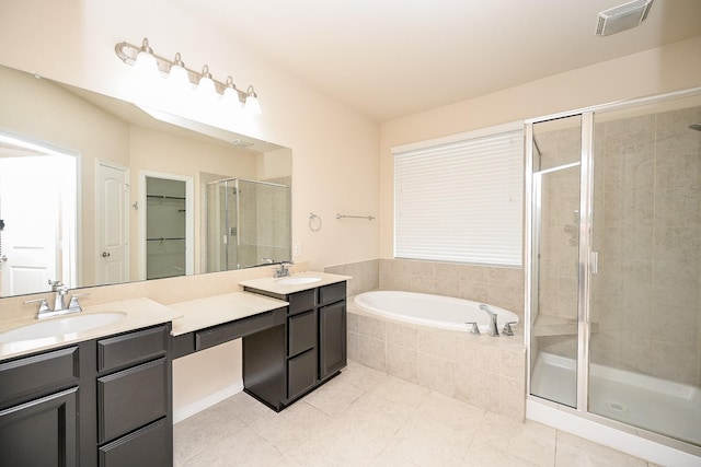 bathroom featuring tile patterned floors, vanity, and plus walk in shower