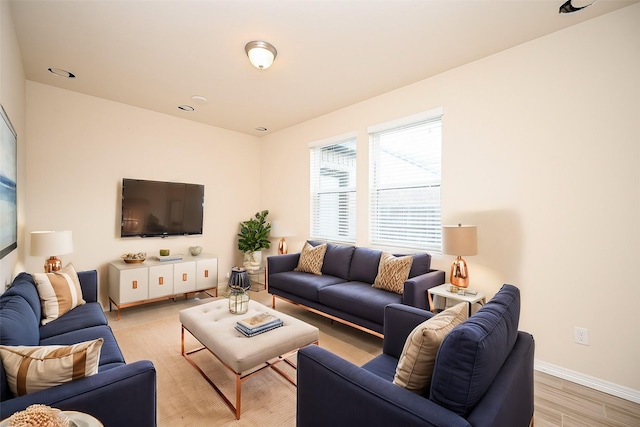 living room with light hardwood / wood-style flooring