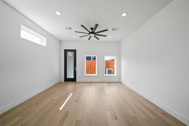 spare room featuring ceiling fan and light hardwood / wood-style flooring