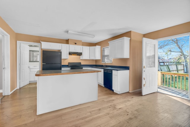 kitchen featuring white cabinetry, a kitchen island, black appliances, and light hardwood / wood-style floors