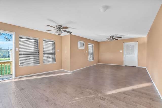 unfurnished room with ceiling fan and light wood-type flooring