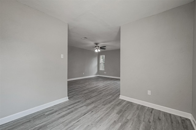 empty room featuring light hardwood / wood-style flooring and ceiling fan