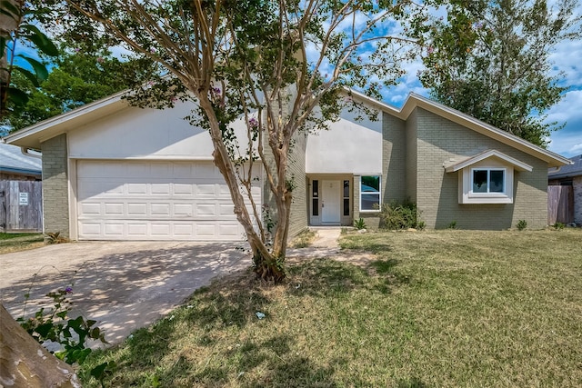 ranch-style house featuring a front yard and a garage