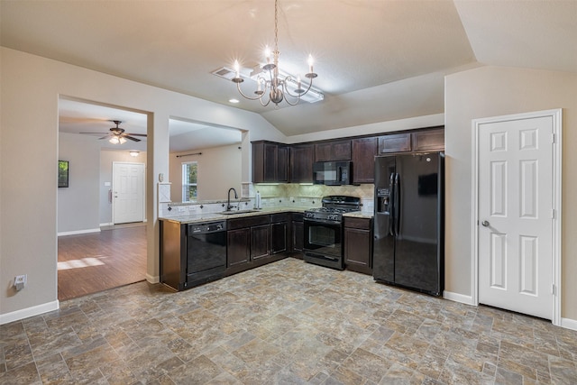 kitchen featuring sink, decorative light fixtures, lofted ceiling, black appliances, and ceiling fan with notable chandelier