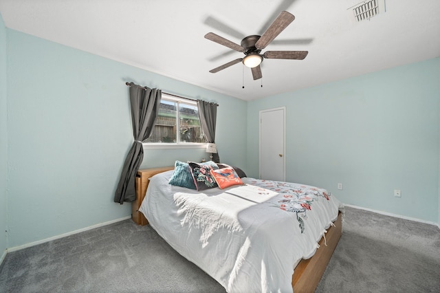 bedroom featuring ceiling fan and dark colored carpet