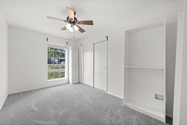 unfurnished bedroom with carpet floors, a closet, and ceiling fan