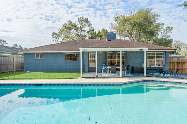 view of swimming pool with a patio