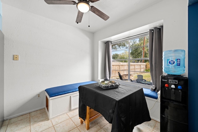 tiled dining room with ceiling fan