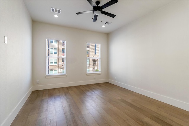 unfurnished room with light hardwood / wood-style floors and ceiling fan