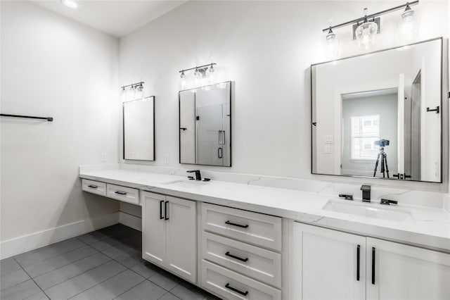 bathroom with tile patterned floors and vanity