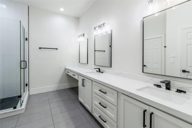 bathroom with tile patterned flooring, vanity, and an enclosed shower