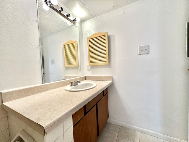 bathroom featuring tile patterned flooring and vanity