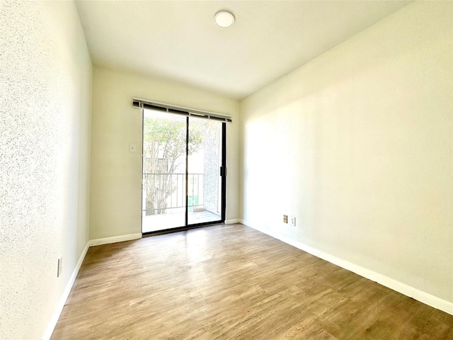 spare room featuring light hardwood / wood-style floors