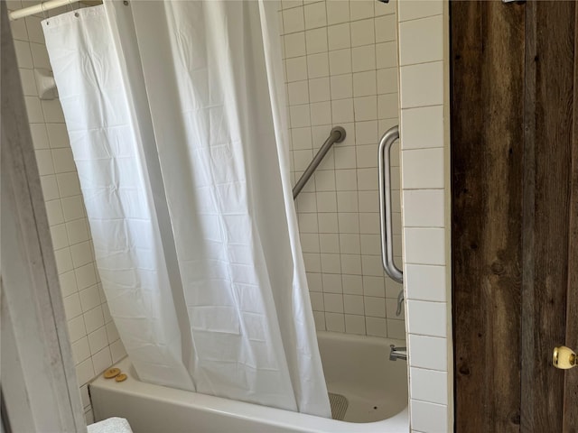 bathroom with shower / bathtub combination with curtain