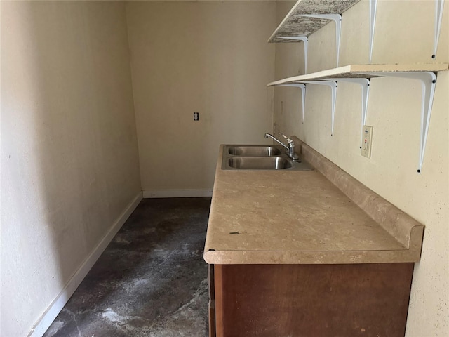 clothes washing area with sink