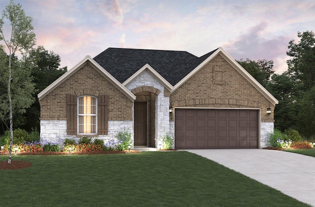 view of front of home featuring a garage and a lawn