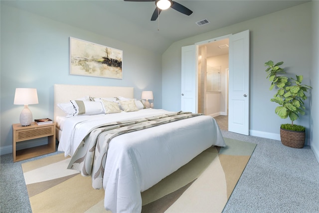 bedroom featuring ceiling fan, light carpet, and vaulted ceiling