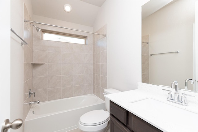 full bathroom with vanity, toilet, and tiled shower / bath combo