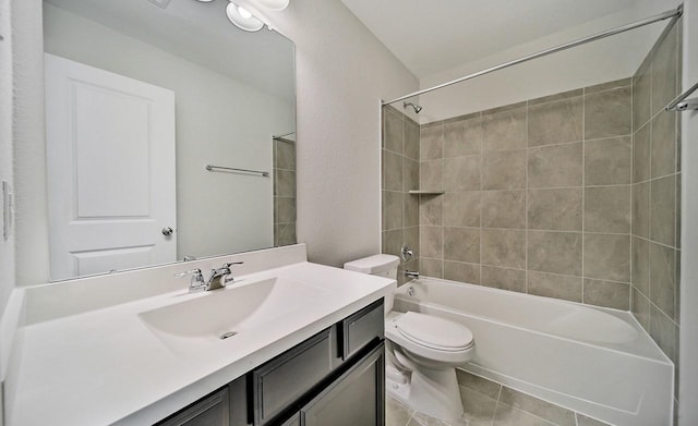 full bath with tile patterned flooring, bathing tub / shower combination, vanity, and toilet