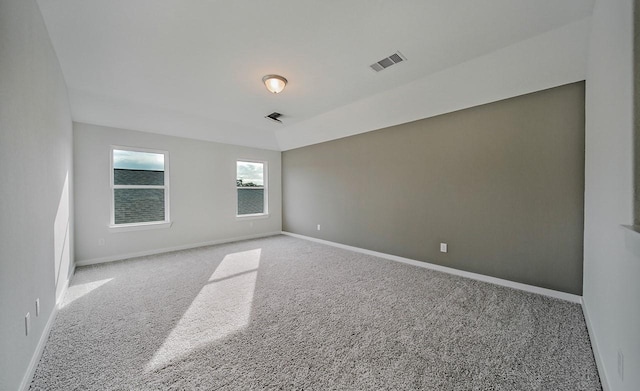 unfurnished room featuring light colored carpet