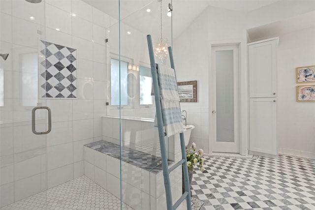 bathroom with a chandelier and an enclosed shower