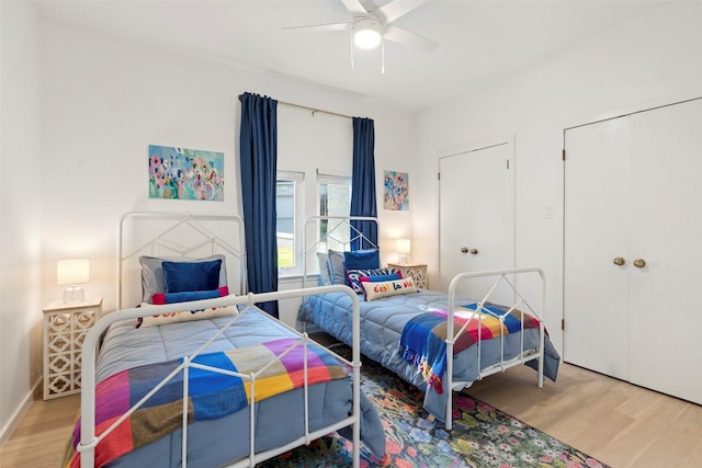 bedroom featuring light hardwood / wood-style floors and ceiling fan