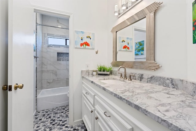 full bathroom with tile patterned flooring, vanity, toilet, and tiled shower / bath