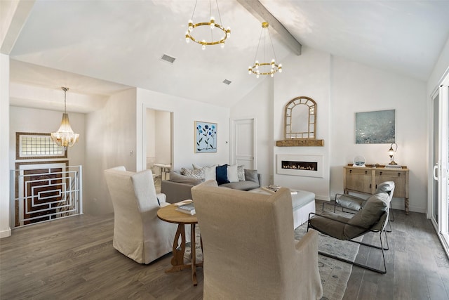 living room with lofted ceiling with beams, dark wood-type flooring, and an inviting chandelier