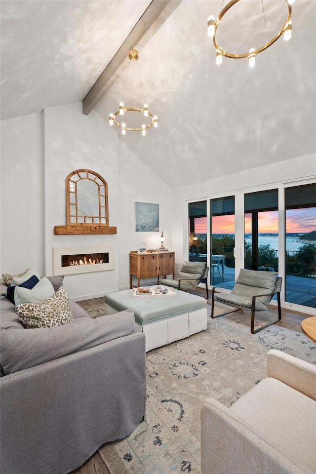 living room with an inviting chandelier, beamed ceiling, high vaulted ceiling, and hardwood / wood-style flooring