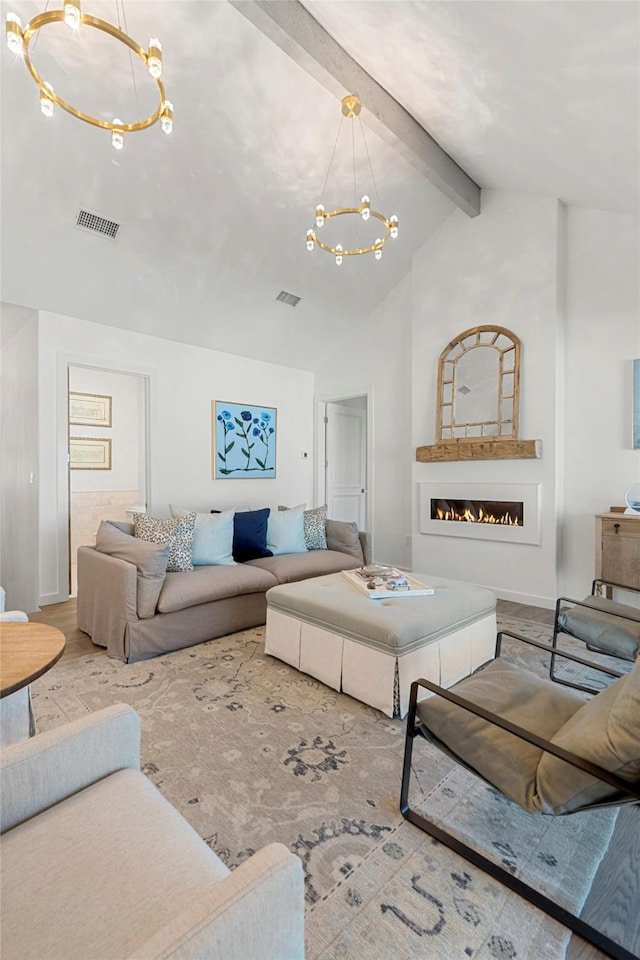 living room featuring beamed ceiling, a chandelier, and high vaulted ceiling