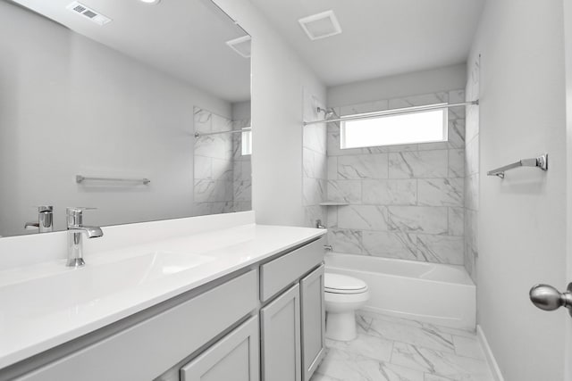 full bathroom with vanity, tiled shower / bath combo, and toilet