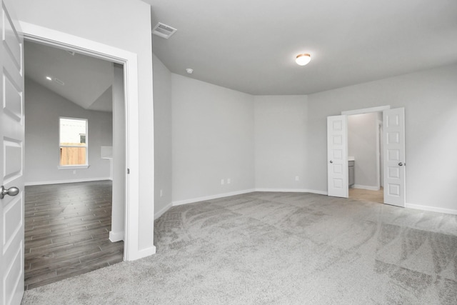 unfurnished bedroom with baseboards, visible vents, and carpet floors