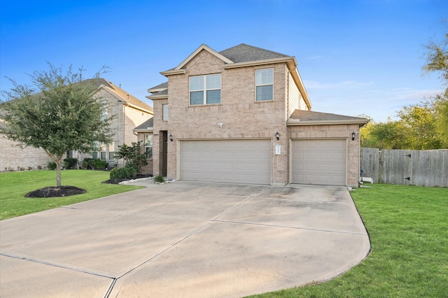 view of front of property with a garage and a front yard