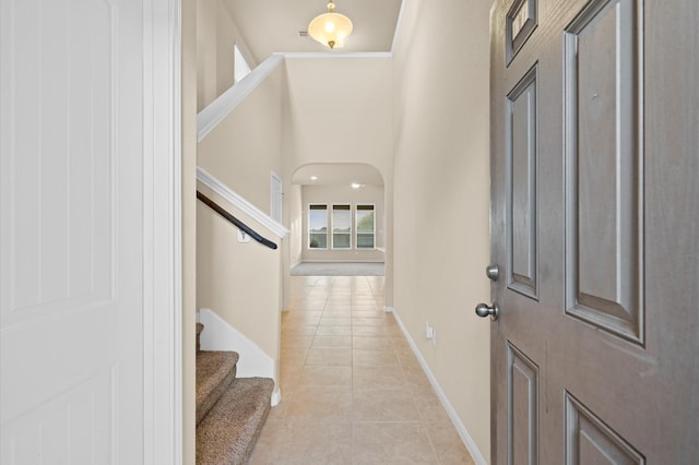 foyer entrance with light tile patterned floors