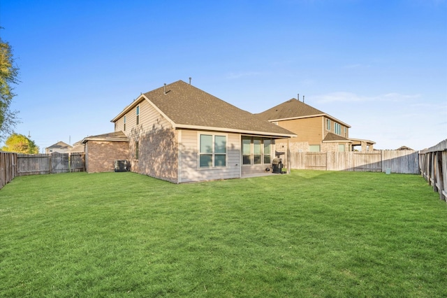 back of house with a lawn