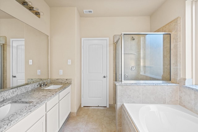 bathroom with tile patterned flooring, vanity, and separate shower and tub