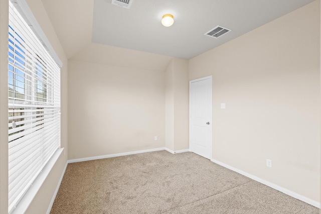 unfurnished room featuring carpet