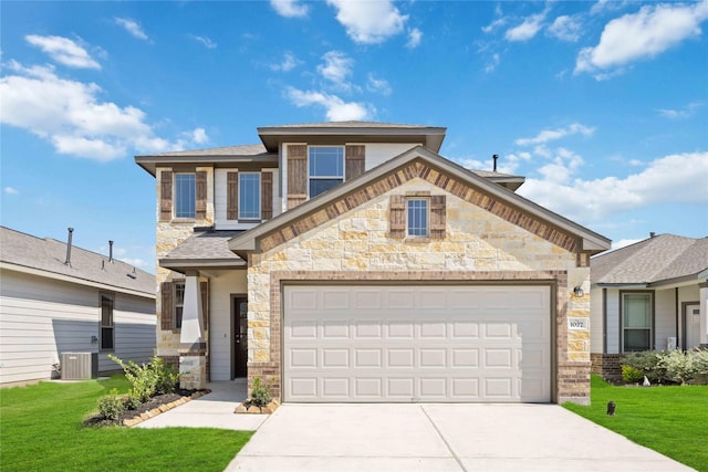 view of front of property featuring a front lawn, a garage, and central AC unit