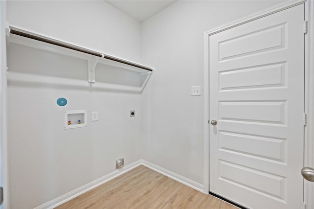 laundry room with hookup for an electric dryer, hookup for a washing machine, and light hardwood / wood-style flooring