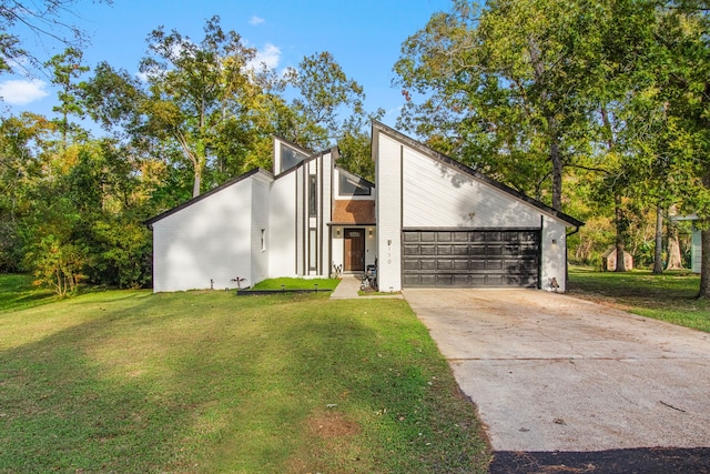 modern home with a front lawn and a garage